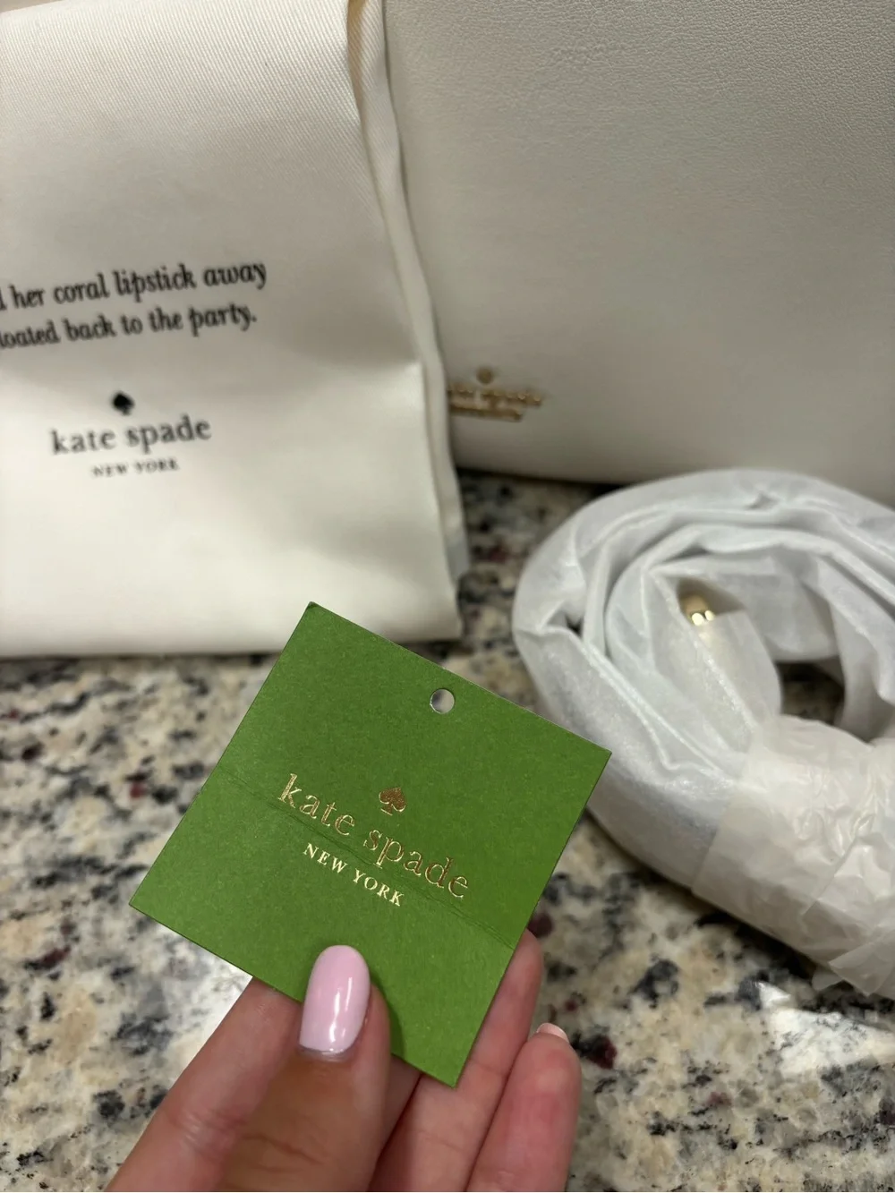 kate spade white leather bag with gold circular handle